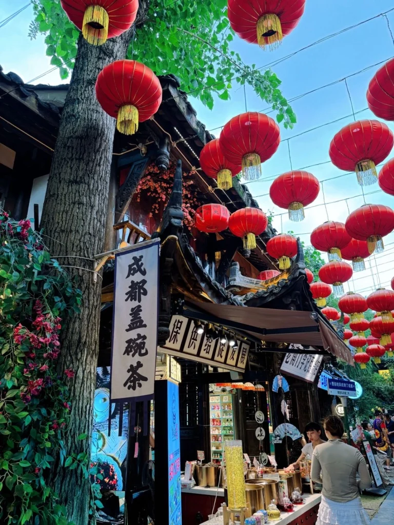 Red lanterns hanging above a traditional Chinese teahouse in Chengdu adding to the charming atmosphere