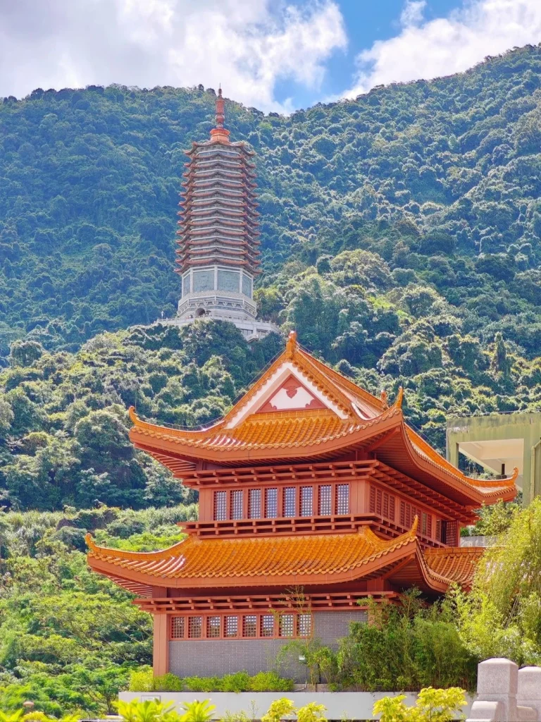 Scenic view of Shenzhen temple pagoda nestled in lush green mountains
