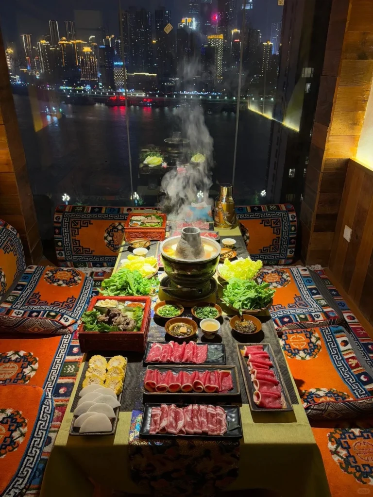 A vibrant hot pot feast overlooking the dazzling nighttime cityscape of Chongqing through a glass window