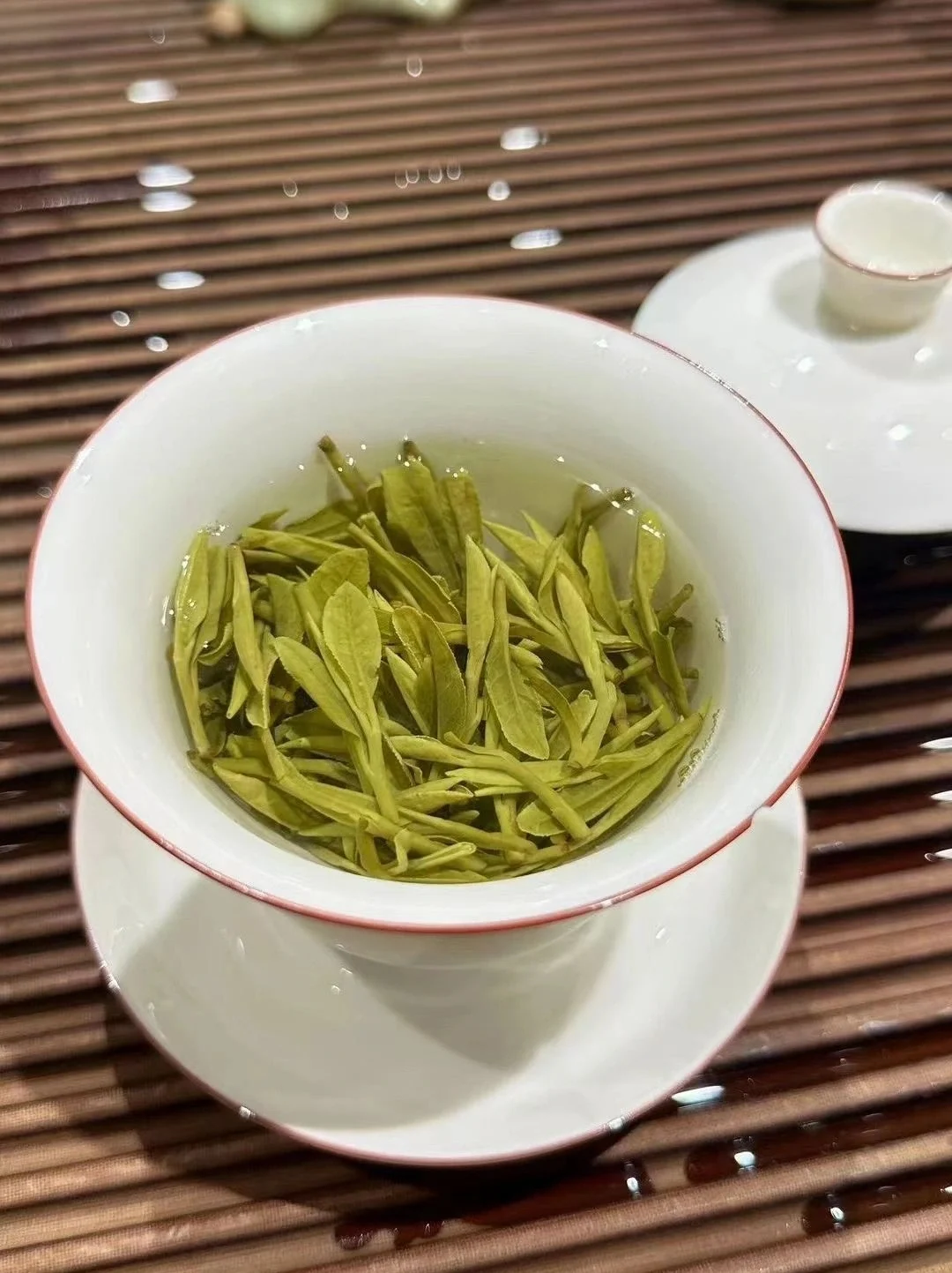Aerial view of Longjing tea fields and traditional houses in Longjing Village