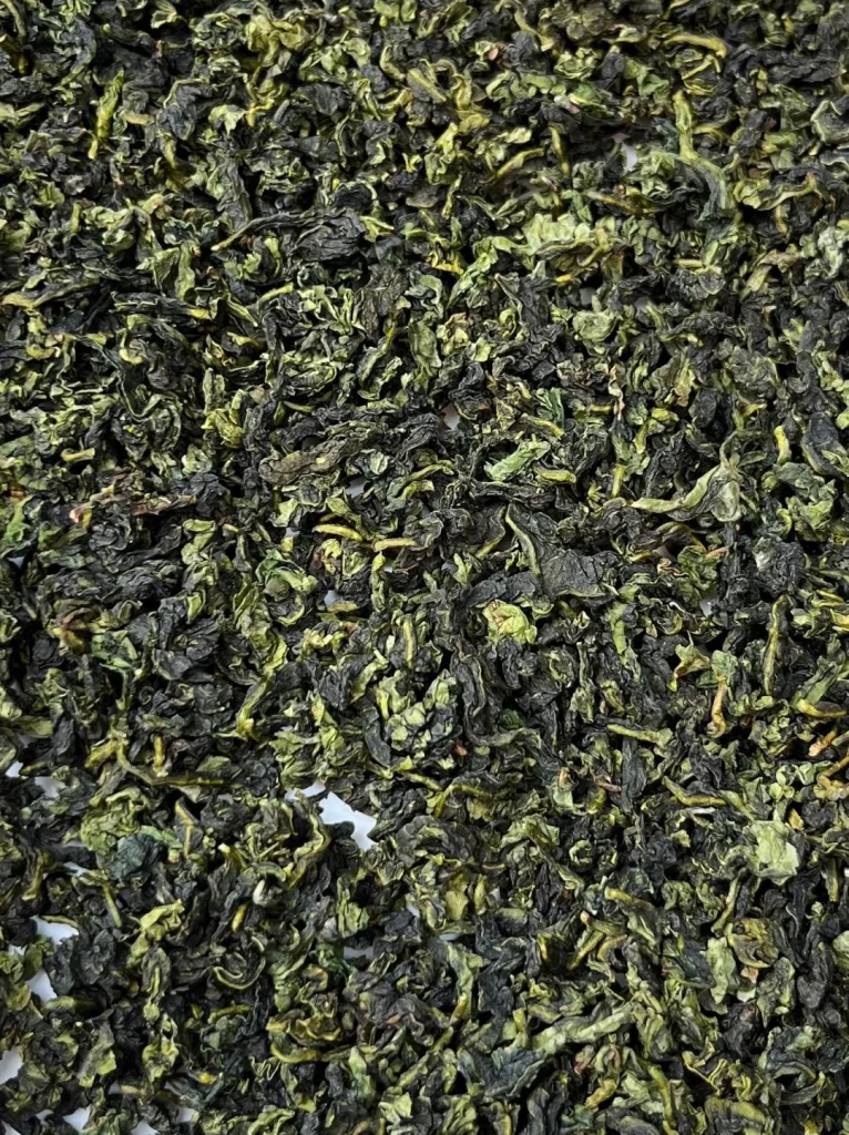 Spread of Dried Tieguanyin Tea Leaves on a Flat Surface