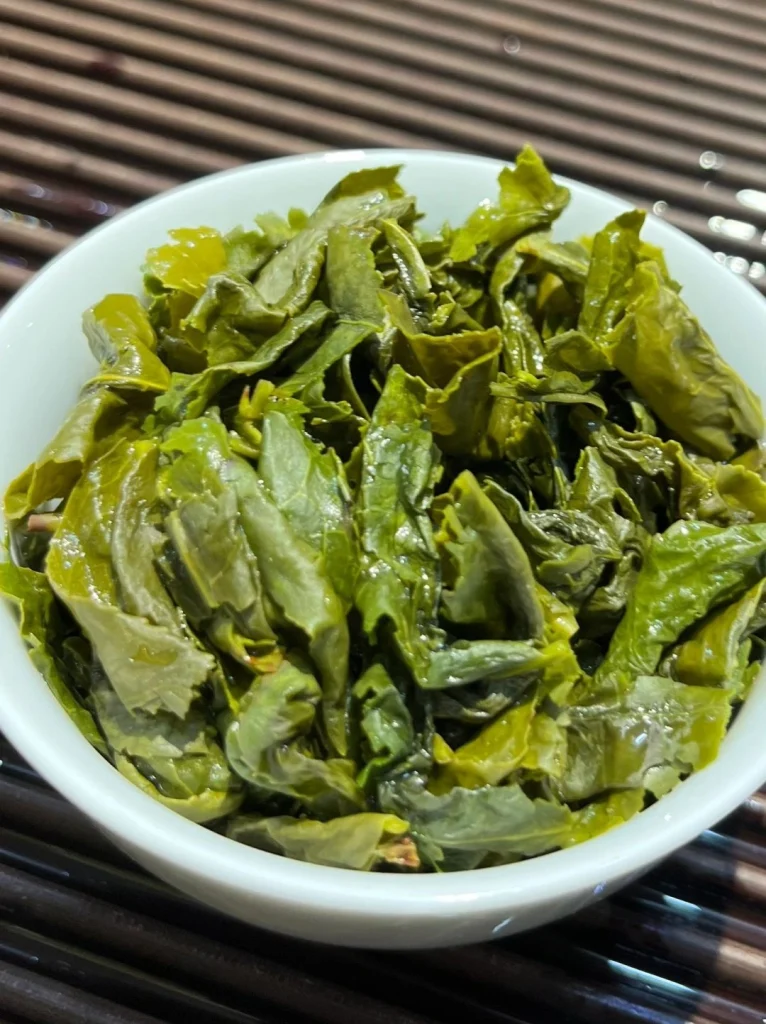 Steamed Tieguanyin Tea Leaves in a White Bowl