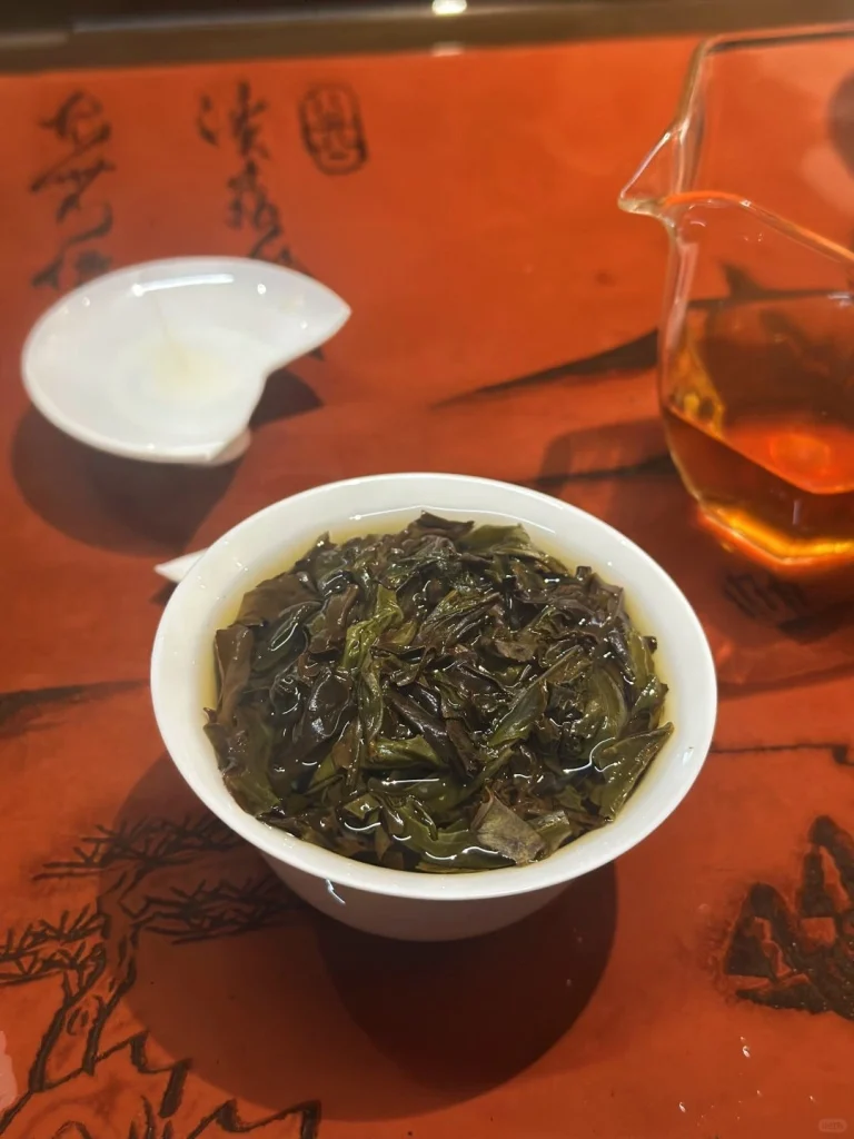 Steamed Wuyi Rock Tea Leaves in a Traditional Tea Bowl