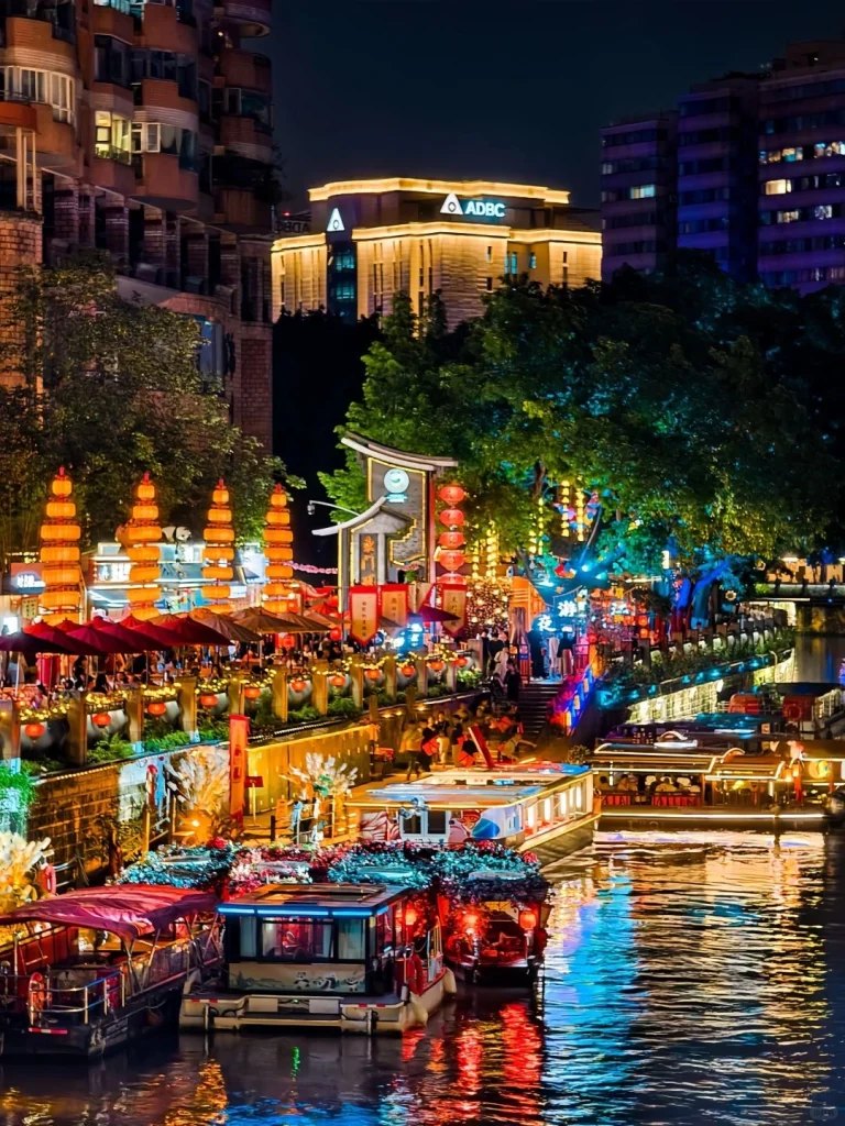 Chengdus vibrant night market with colorful boats and lights highlighting local culture