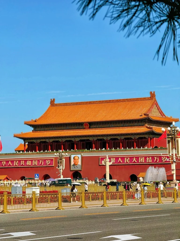 Tiananmen Gate Beijing The iconic Tiananmen Gate in Beijing China with its grand red walls and golden roof under a clear blue sky