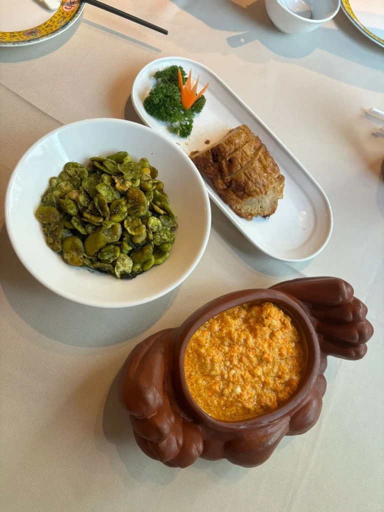 A plate of stir fried vegetables and vegan dishes served at Gong Delin emphasizing vegetarian options