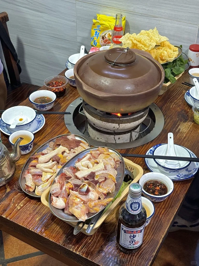 A steaming pot of hotpot featuring fresh ingredients showcasing the vibrant flavors of Guangdong cuisine