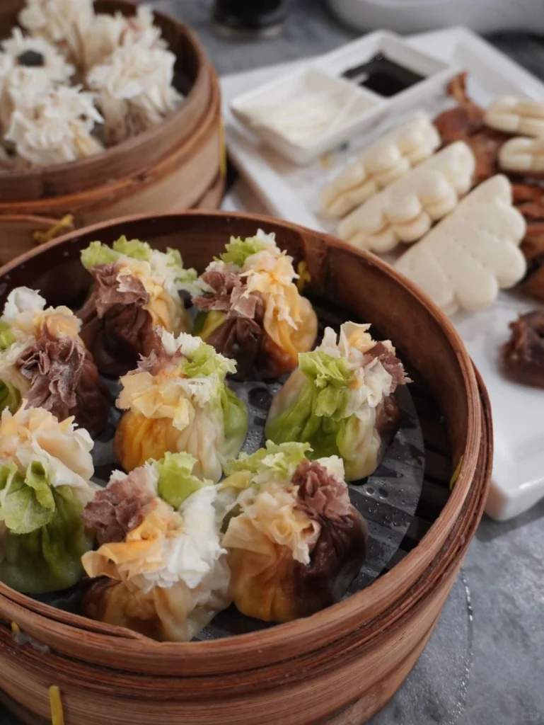 A traditional bamboo steamer with a variety of delicious dumplings served at Du Yi Chu restaurant in Beijing