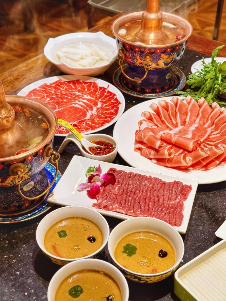 Beijing Copper Pot Hot Pot A bustling Beijing restaurant with a copper hot pot fresh meats vegetables and tasty condiments
