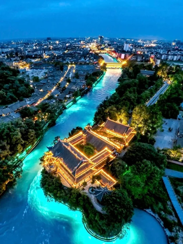 Chengdu Night View from Qingyang Temple Aerial night view of Chengdu cityscape with lights illuminating the river and traditional buildings