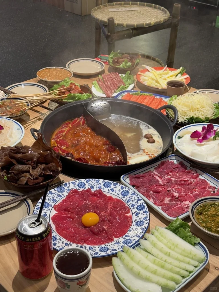 Chongqing hotpot with spicy broth and fresh ingredients Delicious and fiery hotpot with meat and vegetables
