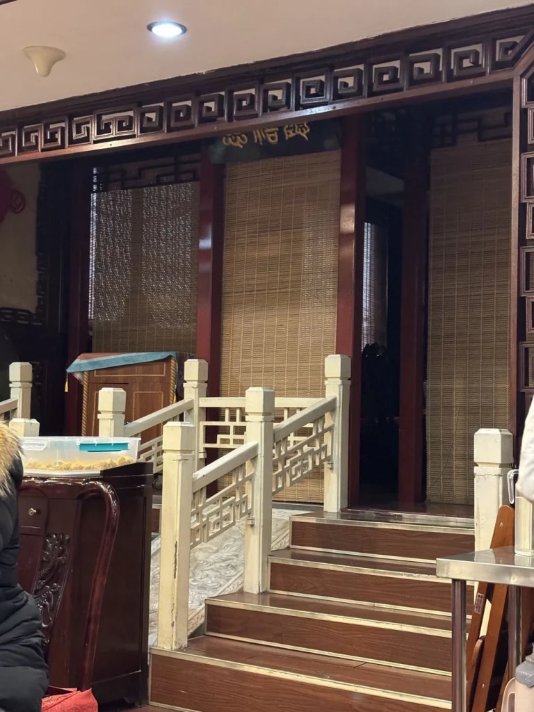 Dog Bites Bun restaurant entrance Welcoming atmosphere with traditional decor and colorful lanterns guiding visitors inside