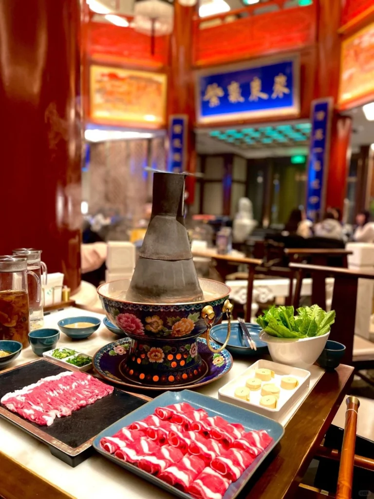 Dong Lai Shun hot pot in Beijing Traditional copper pot hot pot served with sliced beef and various side dishes in a vibrant cozy restaurant setting