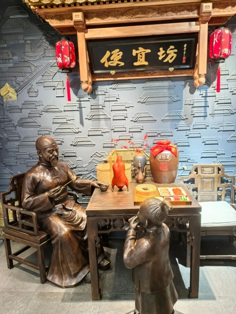 Exterior of a renowned Beijing roast duck restaurant with traditional decorations and welcoming atmosphere
