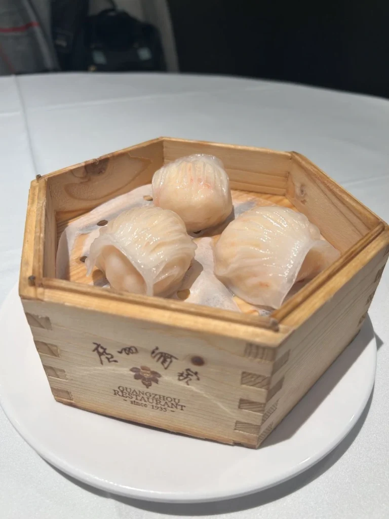 Guangzhou Restaurant Dim Sum Steamed shrimp dumplings in a wooden bamboo basket at Guangzhou Restaurant since 1935