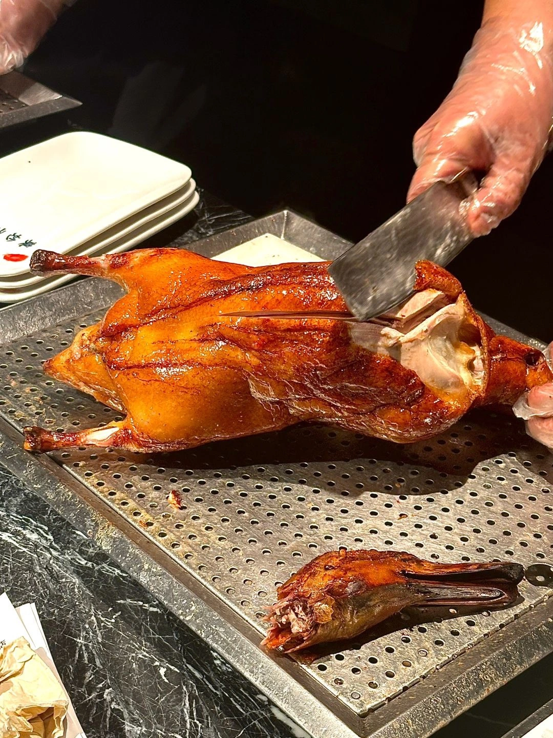 Historical Peking Duck restaurant A chef carving Peking Duck at the 160 year old Quan Jude restaurant a Beijing institution for roasted duck