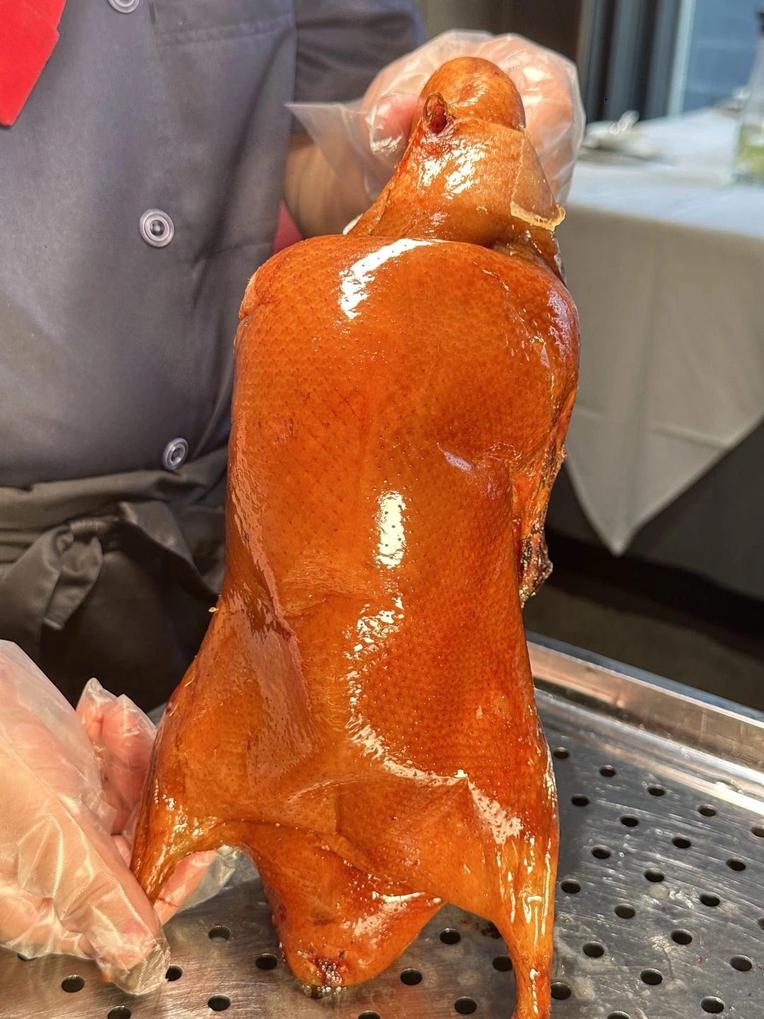 Quan Jude Peking Duck preparation Whole Peking Duck being carefully prepared and sliced at the famous Quan Jude restaurant in Beijing