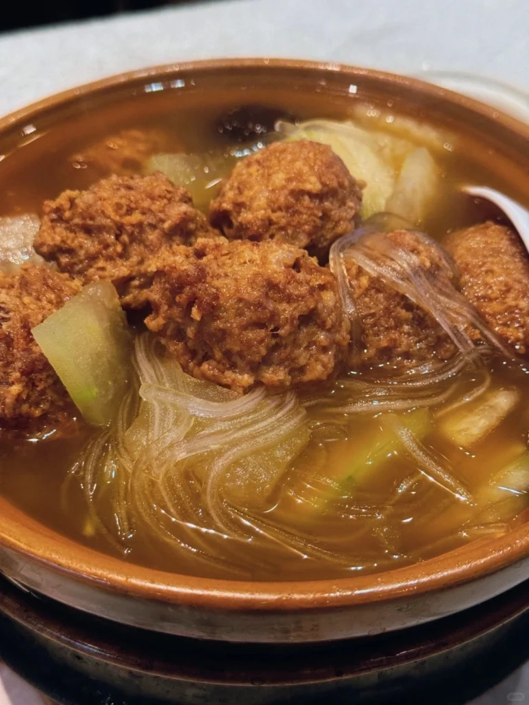 Shaguojus signature meatball dish A delicious bowl of meatball soup served with clear broth and glass noodles at Shaguoju restaurant in Beijing