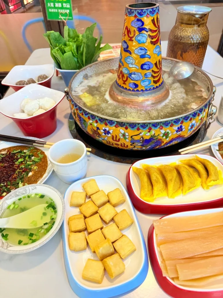 Traditional Inner Mongolian Hot Pot Ice and mutton in an ornate copper pot