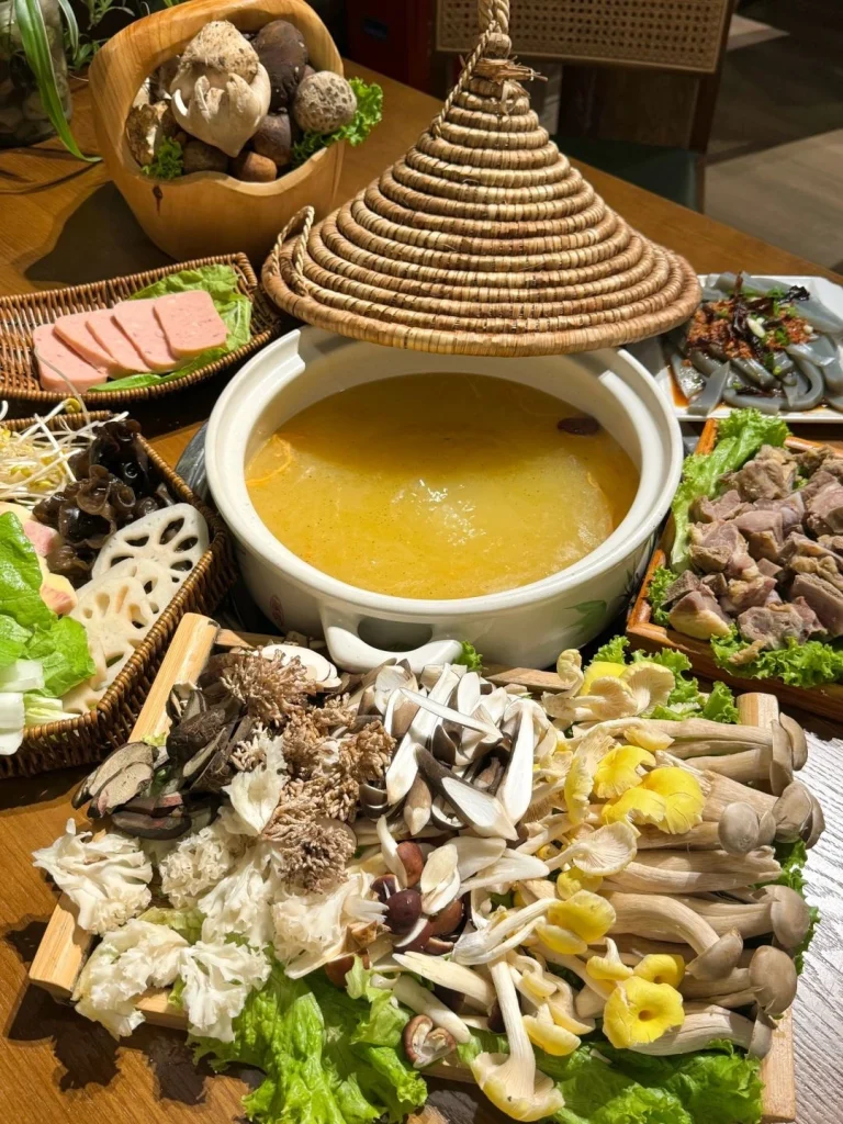Yunnan mushroom hotpot with a selection of wild mushrooms and fresh ingredients in a hot broth