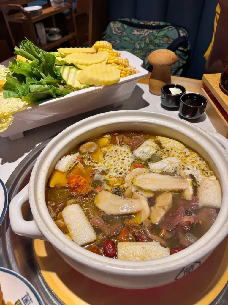 Yunnan mushroom hotpot with assorted wild mushrooms meats and vegetables in a broth