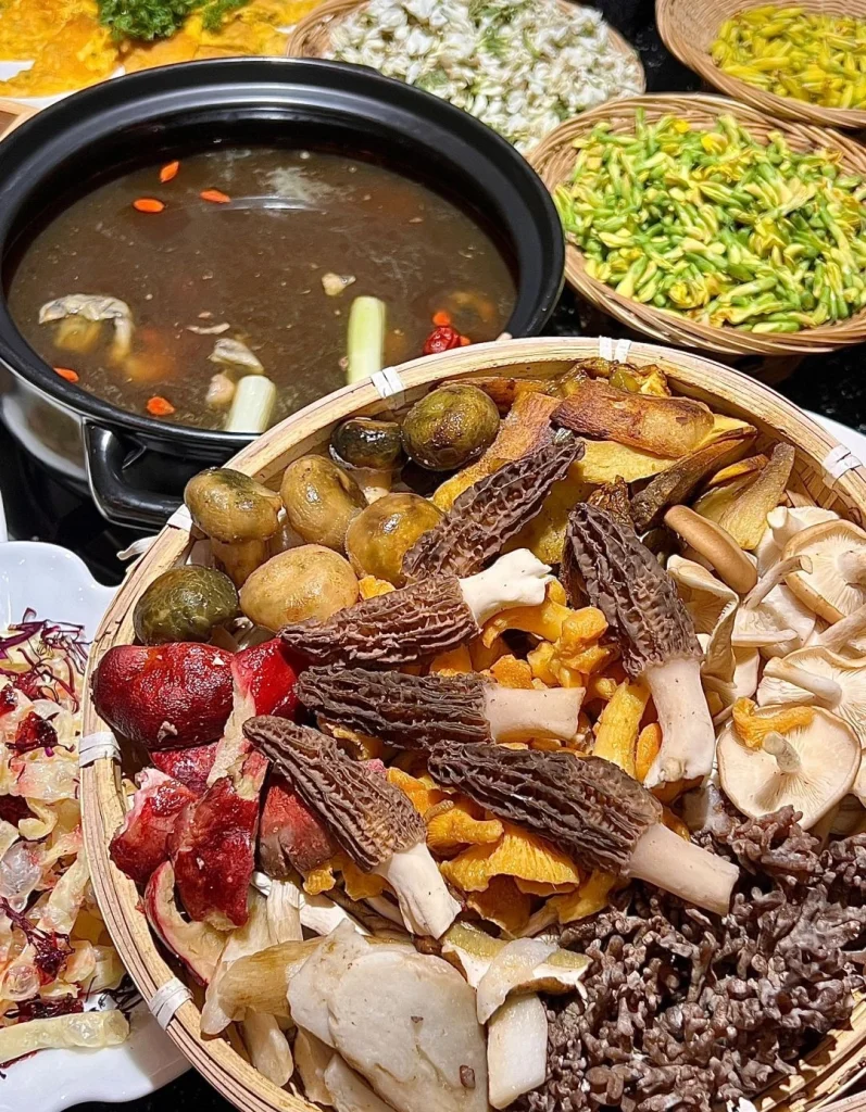 Yunnan wild mushroom hotpot with a variety of mushrooms and vegetables in a flavorful broth