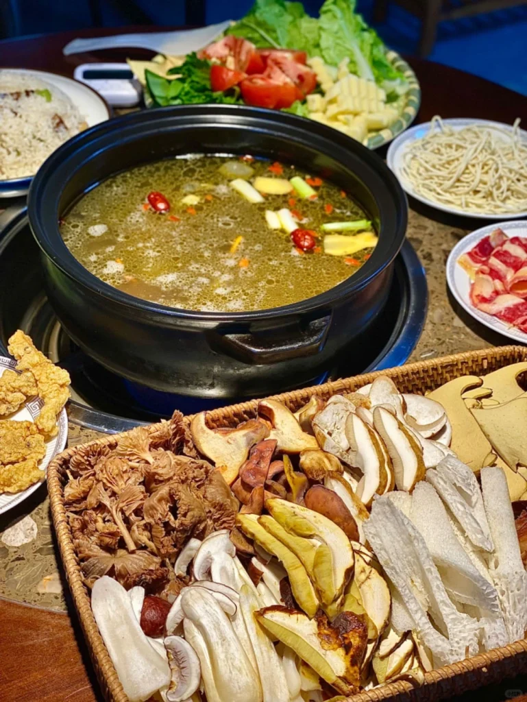 Yunnan wild mushroom hotpot with a variety of mushrooms herbs and fresh ingredients