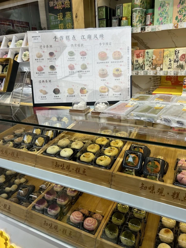 Zhiwei Guan bakery display A showcase of various hand made traditional pastries from Zhiwei Guan displayed neatly in the store