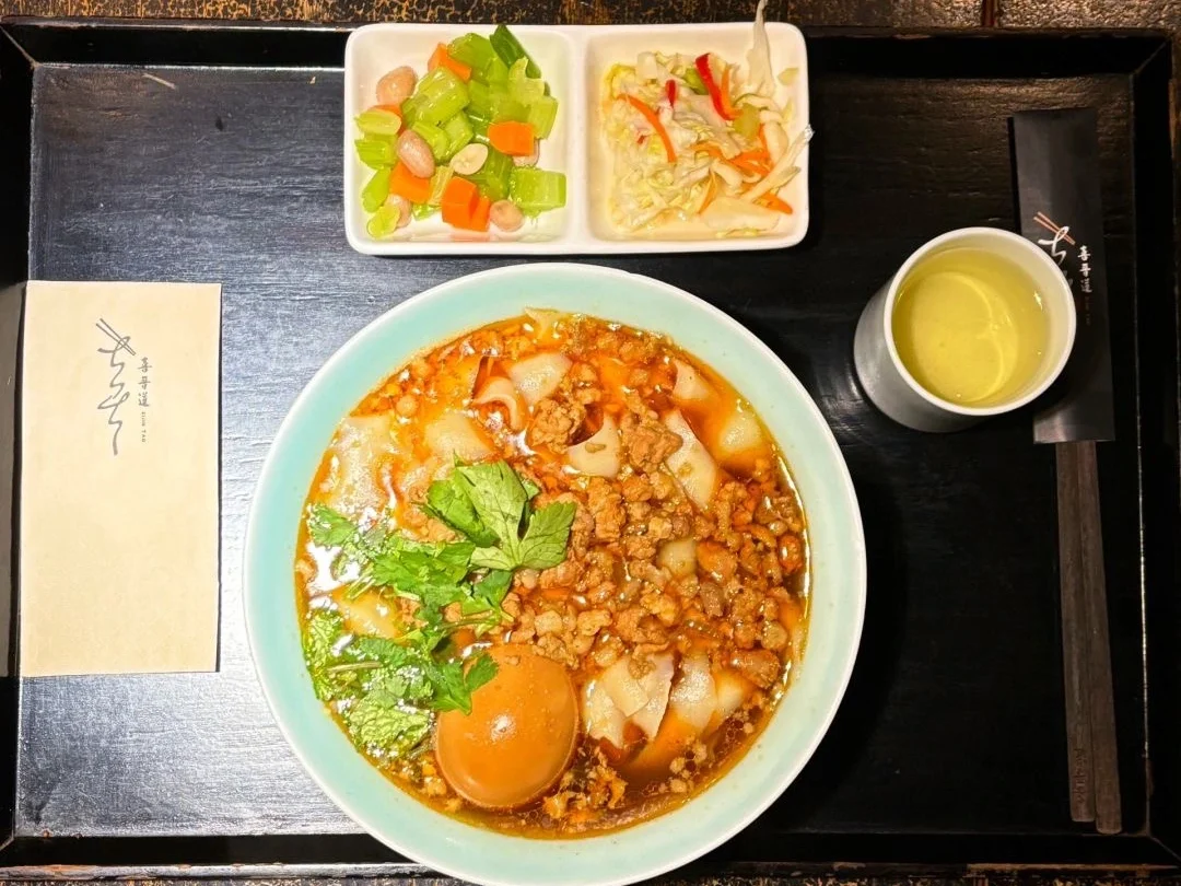 A bowl of knife cut noodles with vegetables and an egg on top A hearty serving of knife cut noodles accompanied by vegetables and a boiled egg. - What Do Chinese People Eat the Most? 2026 - The China Journey A bowl of knife cut noodles with vegetables and an egg on top A hearty serving of knife cut noodles accompanied by vegetables and a boiled egg. - What Do Chinese People Eat the Most? 2026 - The China Journey