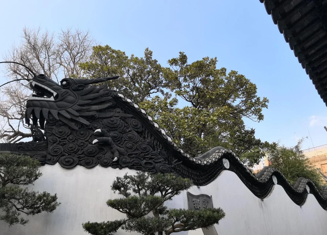Ornate dragon wall sculpture in Yu Garden, Shanghai - Yu Garden Shanghai: Is It Worth Visiting? 2026 - The China Journey Ornate dragon wall sculpture in Yu Garden, Shanghai - Yu Garden Shanghai: Is It Worth Visiting? 2026 - The China Journey