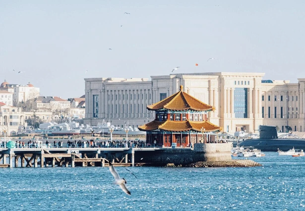 Historic Zhanqiao Pier with its octagonal Huilan Pavilion extending into Qingdao Bay - Where to Stay in Qingdao: Best Areas & Hotels 2026 - The China Journey Historic Zhanqiao Pier with its octagonal Huilan Pavilion extending into Qingdao Bay - Where to Stay in Qingdao: Best Areas & Hotels 2026 - The China Journey