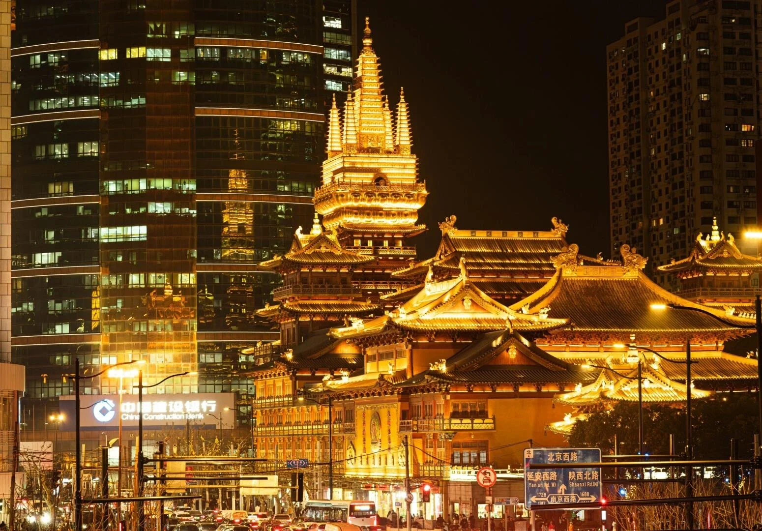 Night view of Jing’an Temple’s golden Tang style rooftops framed by Shanghai skyscrapers