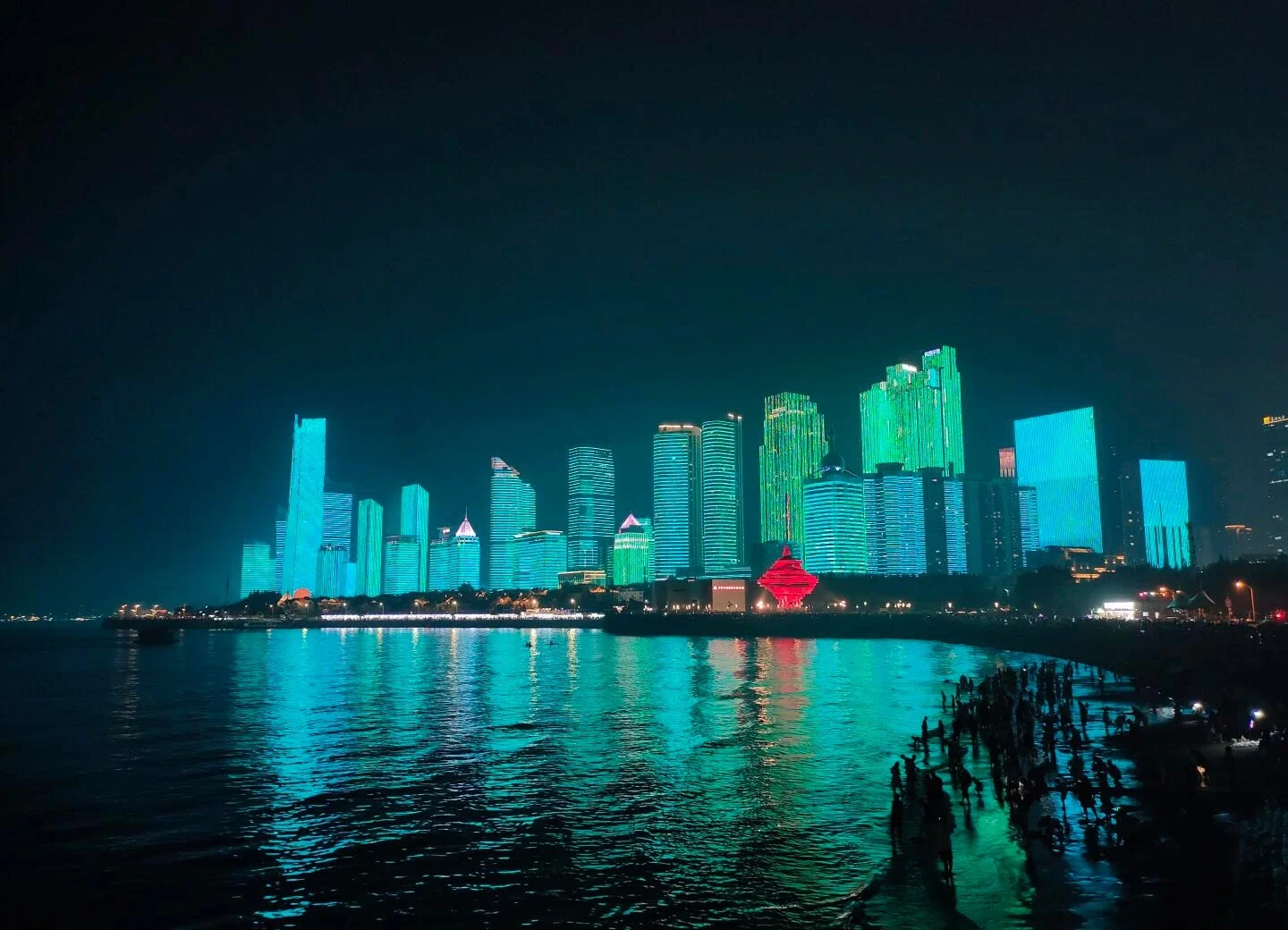 Nighttime panorama of May Fourth Square skyscraper lights reflecting in Qingdao’s waterfront - Where to Stay in Qingdao: Best Areas & Hotels 2026 - The China Journey Nighttime panorama of May Fourth Square skyscraper lights reflecting in Qingdao’s waterfront - Where to Stay in Qingdao: Best Areas & Hotels 2026 - The China Journey