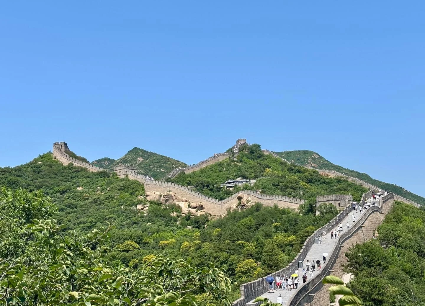 Solitary panorama of Badaling Great Wall ridge under clear blue sky with no crowd