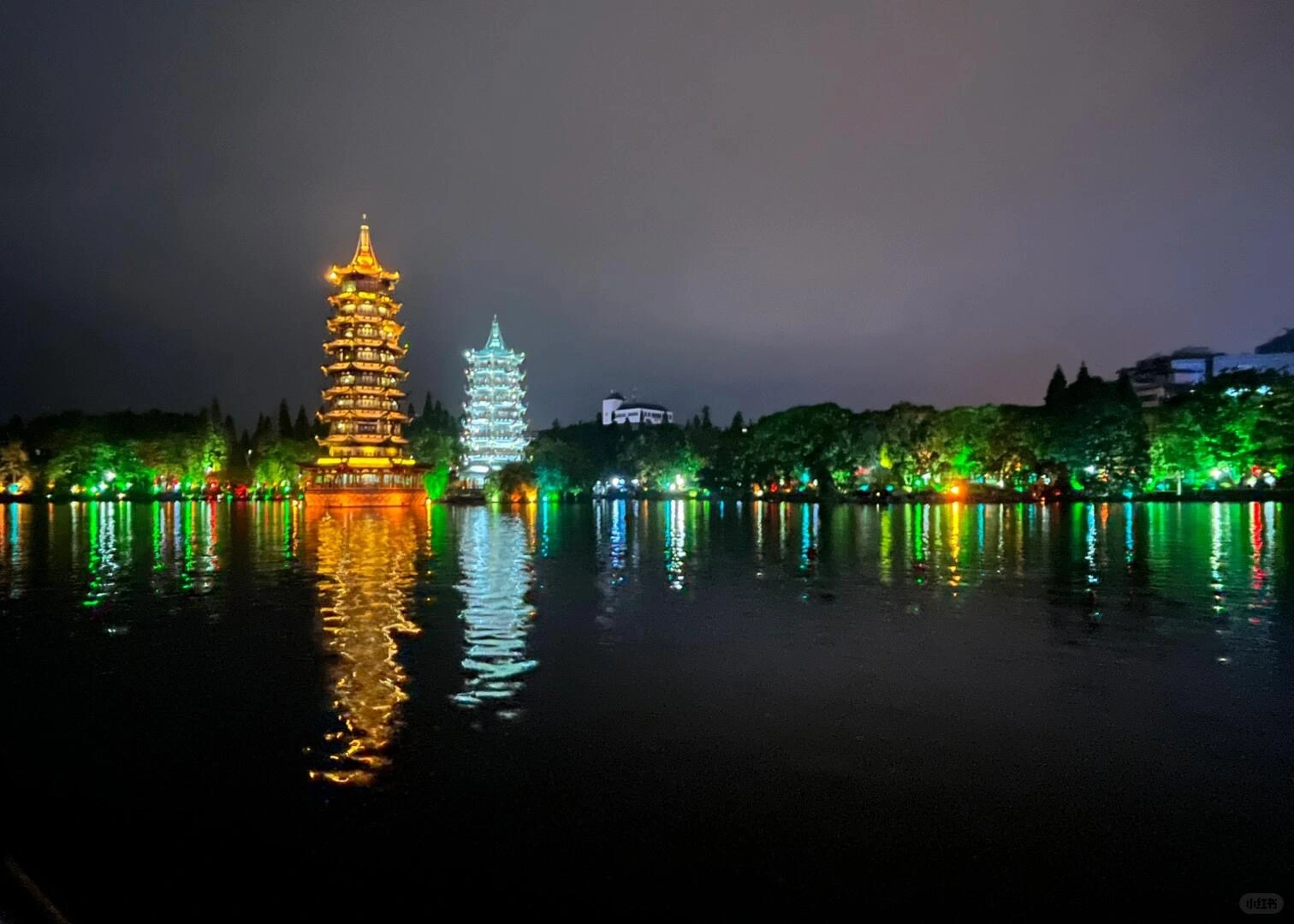 Sun and Moon Twin Pagodas lit up at night in Guilin’s Two Rivers and Four Lakes area - Where to Stay in Guilin: Best Areas & Hotels 2026 - The China Journey Sun and Moon Twin Pagodas lit up at night in Guilin’s Two Rivers and Four Lakes area - Where to Stay in Guilin: Best Areas & Hotels 2026 - The China Journey