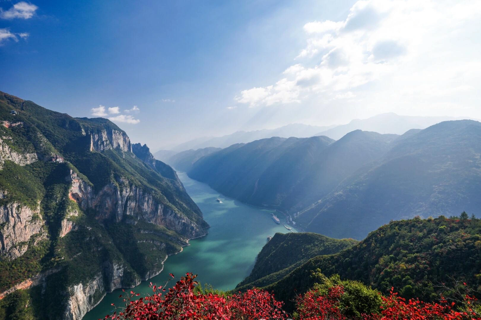 Scenic view of Wu Gorge on Yangtze River with red leaves in foreground and misty mountains - Yangtze River (Chang Jiang): Cruise Guide, Map & Top Sights 2026 - The China Journey Scenic view of Wu Gorge on Yangtze River with red leaves in foreground and misty mountains - Yangtze River (Chang Jiang): Cruise Guide, Map & Top Sights 2026 - The China Journey