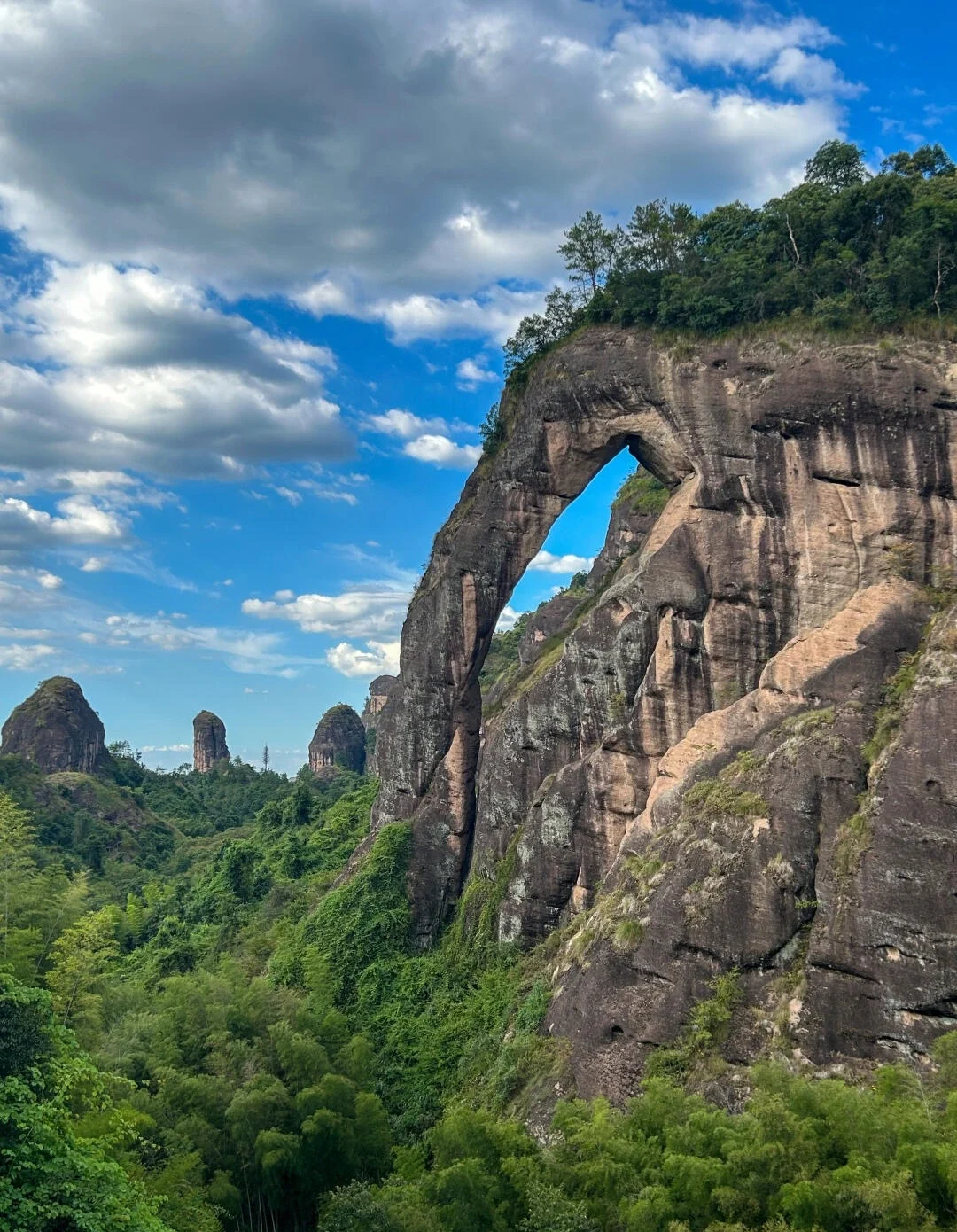 Longhu Mountain Danxia Landform Arch Natural rock arch formation and lush valley landscape in Taoist sacred mountain Jiangxi - Jiangxi Travel Guide: Routes, Tips & Itineraries 2026 - The China Journey Longhu Mountain Danxia Landform Arch Natural rock arch formation and lush valley landscape in Taoist sacred mountain Jiangxi - Jiangxi Travel Guide: Routes, Tips & Itineraries 2026 - The China Journey