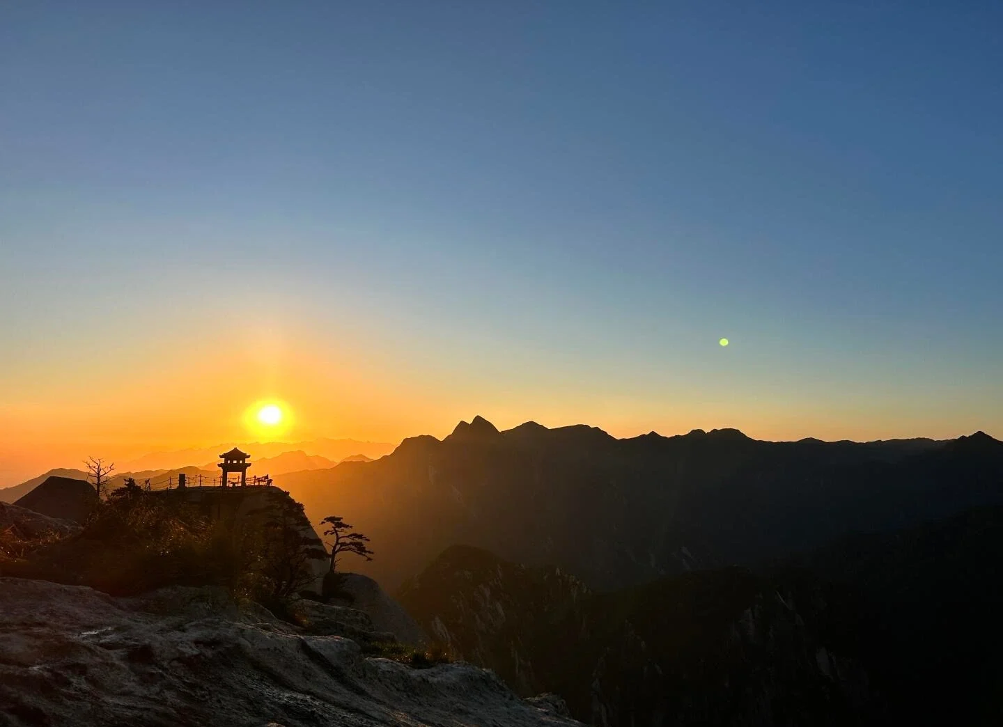 Mount Huashan East Peak Sunrise golden sunrise beside pavilion over mountain ridges - Mount Huashan Travel Guide: Best Routes, Tips & Day Trip 2026 - The China Journey Mount Huashan East Peak Sunrise golden sunrise beside pavilion over mountain ridges - Mount Huashan Travel Guide: Best Routes, Tips & Day Trip 2026 - The China Journey