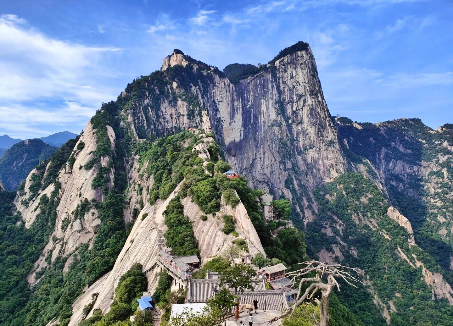Mount Huashan Peaks dramatic granite cliffs and temple complex under blue sky - Mount Huashan Travel Guide: Best Routes, Tips & Day Trip 2026 - The China Journey Mount Huashan Peaks dramatic granite cliffs and temple complex under blue sky - Mount Huashan Travel Guide: Best Routes, Tips & Day Trip 2026 - The China Journey