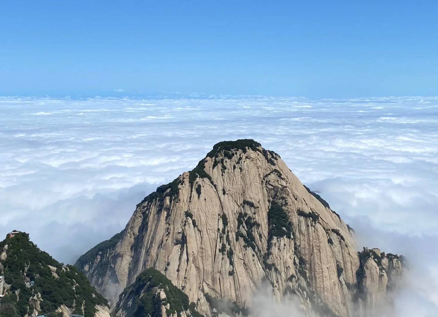 Mount Huashan Sea of Clouds Landscape – isolated granite summit emerging above vast cloud ocean - Mount Huashan Travel Guide: Best Routes, Tips & Day Trip 2026 - The China Journey Mount Huashan Sea of Clouds Landscape – isolated granite summit emerging above vast cloud ocean - Mount Huashan Travel Guide: Best Routes, Tips & Day Trip 2026 - The China Journey