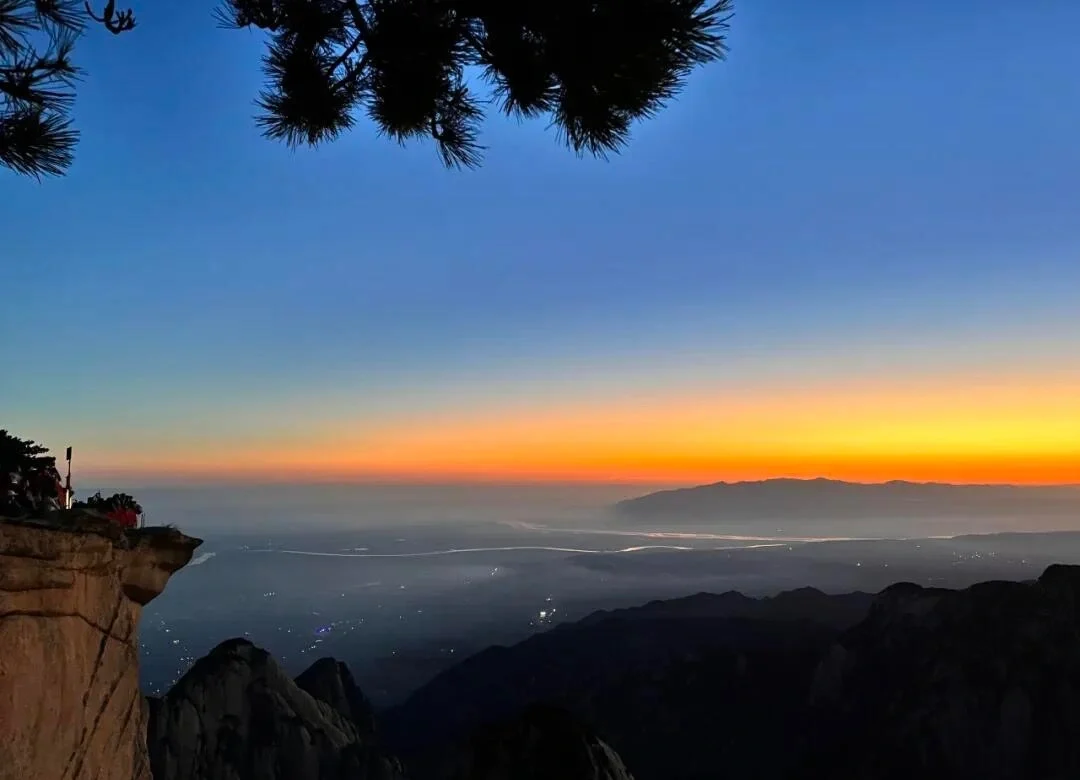 Mount Huashan Sunrise View – glowing sunrise horizon illuminating distant valleys and mountain silhouettes - Mount Huashan Travel Guide: Best Routes, Tips & Day Trip 2026 - The China Journey Mount Huashan Sunrise View – glowing sunrise horizon illuminating distant valleys and mountain silhouettes - Mount Huashan Travel Guide: Best Routes, Tips & Day Trip 2026 - The China Journey