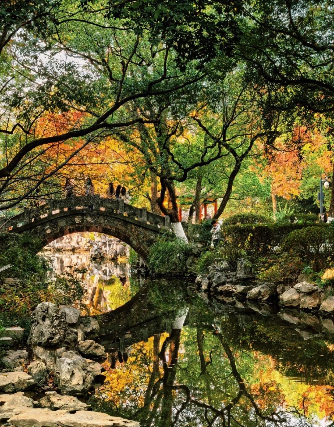 Nanchang Autumn Garden Stone Bridge Traditional Chinese garden with arch bridge reflecting colorful autumn trees and tranquil pond - Jiangxi Travel Guide: Routes, Tips & Itineraries 2026 - The China Journey Nanchang Autumn Garden Stone Bridge Traditional Chinese garden with arch bridge reflecting colorful autumn trees and tranquil pond - Jiangxi Travel Guide: Routes, Tips & Itineraries 2026 - The China Journey