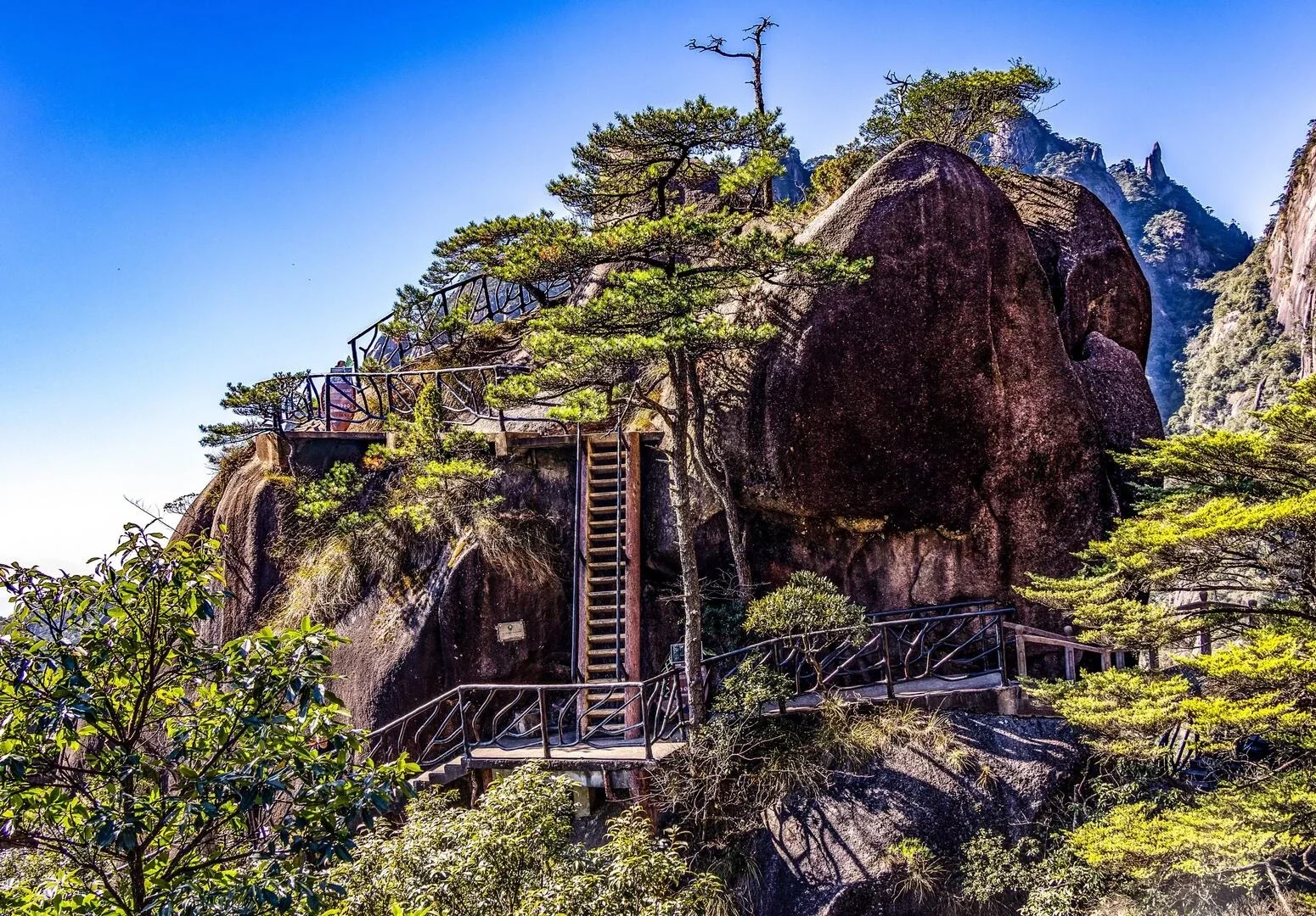 Sanqingshan Mountain Stone Terrace View Rocky peaks with pine trees and scenic walkway under clear blue sky Jiangxi - Jiangxi Travel Guide: Routes, Tips & Itineraries 2026 - The China Journey Sanqingshan Mountain Stone Terrace View Rocky peaks with pine trees and scenic walkway under clear blue sky Jiangxi - Jiangxi Travel Guide: Routes, Tips & Itineraries 2026 - The China Journey