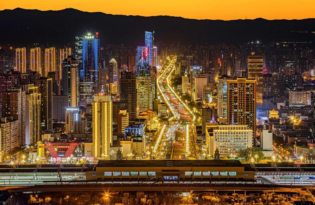 Taiyuan Yingze Avenue Night Skyline Vibrant cityscape with illuminated skyscrapers and busy traffic in Shanxi provincial capital