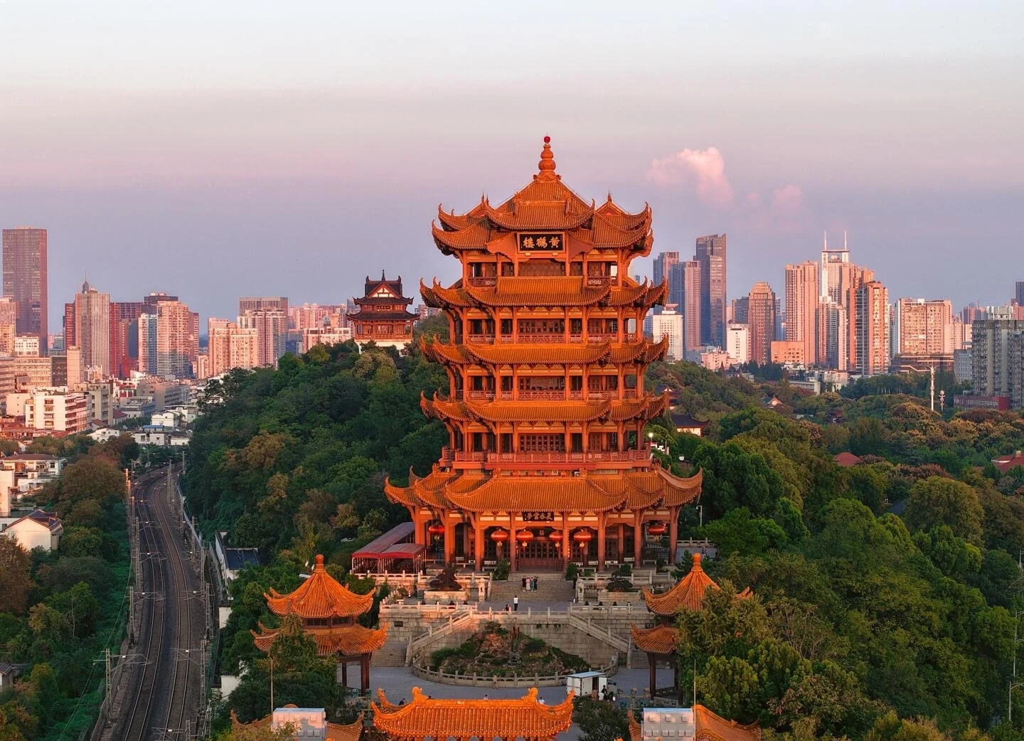 Yellow Crane Tower Wuhan Sunset View Iconic tower glowing in warm sunset light with city skyline in background - Where to Stay in Wuhan: Best Areas & Hotels 2026 - The China Journey Yellow Crane Tower Wuhan Sunset View Iconic tower glowing in warm sunset light with city skyline in background - Where to Stay in Wuhan: Best Areas & Hotels 2026 - The China Journey