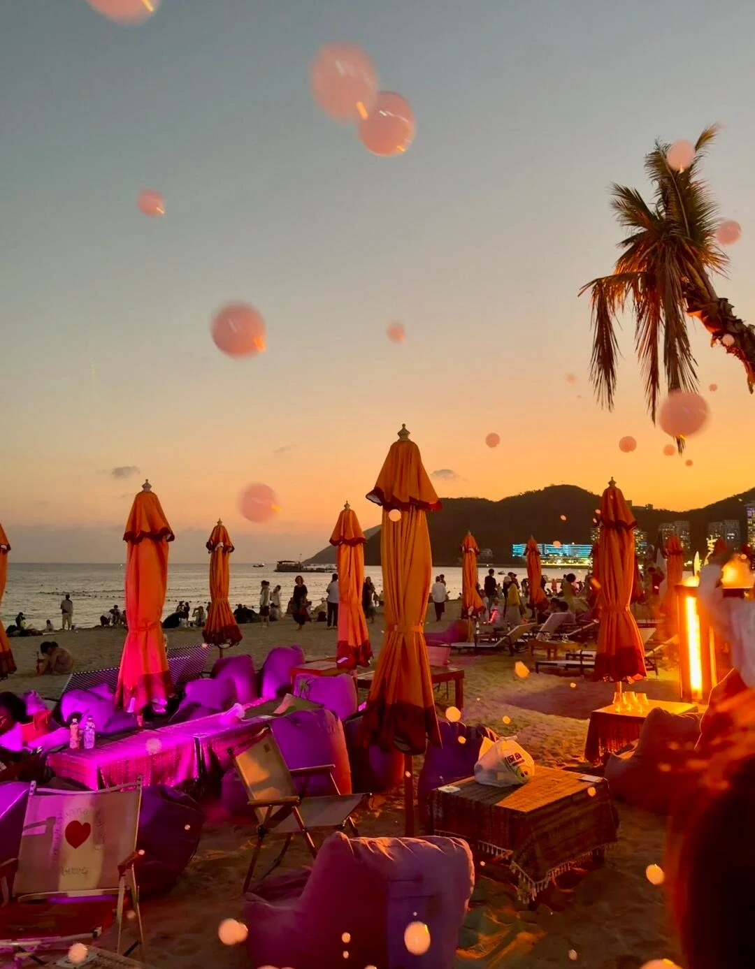 Dadonghai Beach Sunset Lounge Sanya Cozy beach seating with umbrellas and glowing lights create romantic evening seaside vibe - Where to Stay in Sanya: Best Areas & Hotels 2026 - The China Journey Dadonghai Beach Sunset Lounge Sanya Cozy beach seating with umbrellas and glowing lights create romantic evening seaside vibe - Where to Stay in Sanya: Best Areas & Hotels 2026 - The China Journey