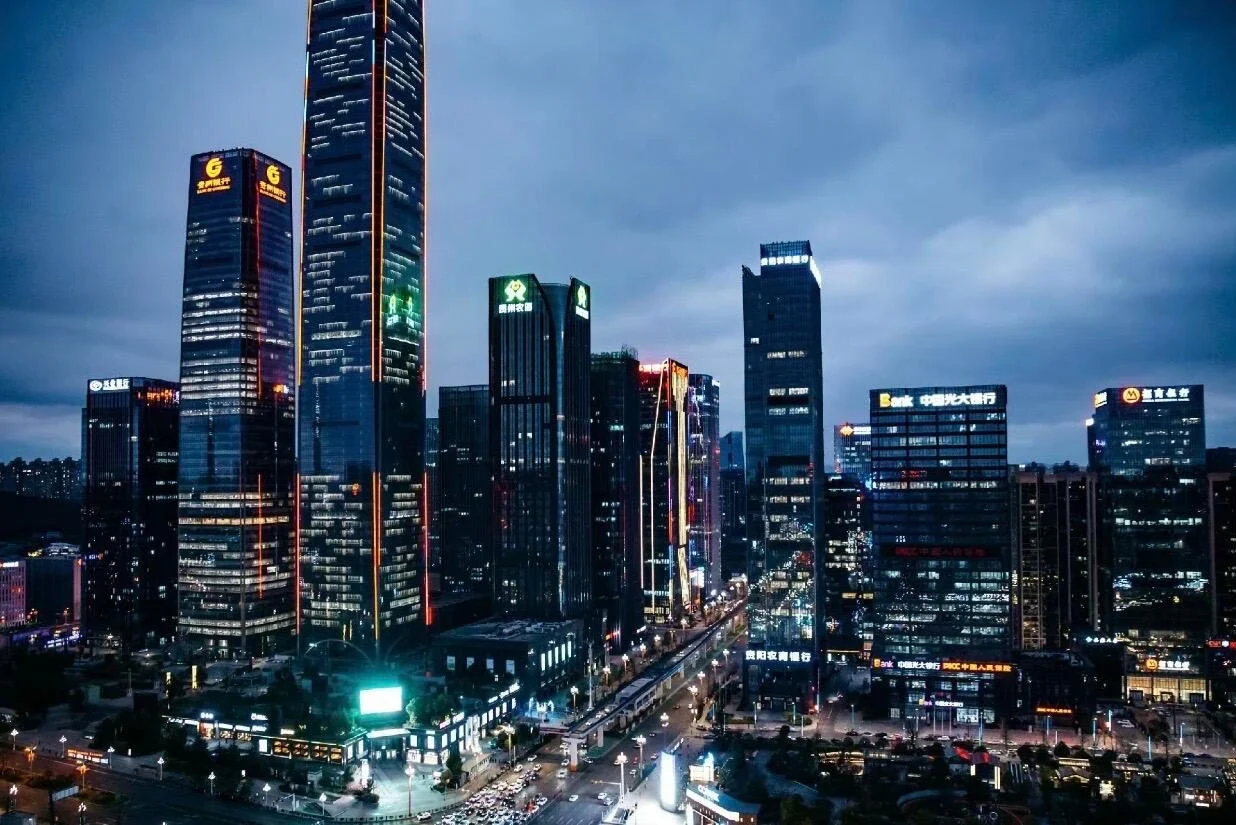 Guiyang Guanshanhu New District Skyline Modern financial district with high rise towers and illuminated business buildings at dusk - Where to Stay in Guiyang: Best Areas & Hotels 2026 - The China Journey Guiyang Guanshanhu New District Skyline Modern financial district with high rise towers and illuminated business buildings at dusk - Where to Stay in Guiyang: Best Areas & Hotels 2026 - The China Journey