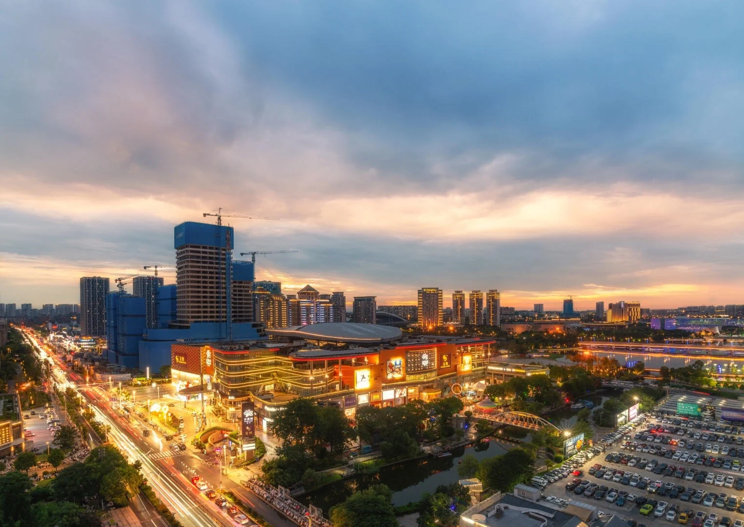 Jinghua City Yangzhou Night Skyline Illuminated shopping mall city lights and modern urban skyline at sunset - Where to Stay in Yangzhou: Best Areas & Hotels 2026 - The China Journey Jinghua City Yangzhou Night Skyline Illuminated shopping mall city lights and modern urban skyline at sunset - Where to Stay in Yangzhou: Best Areas & Hotels 2026 - The China Journey