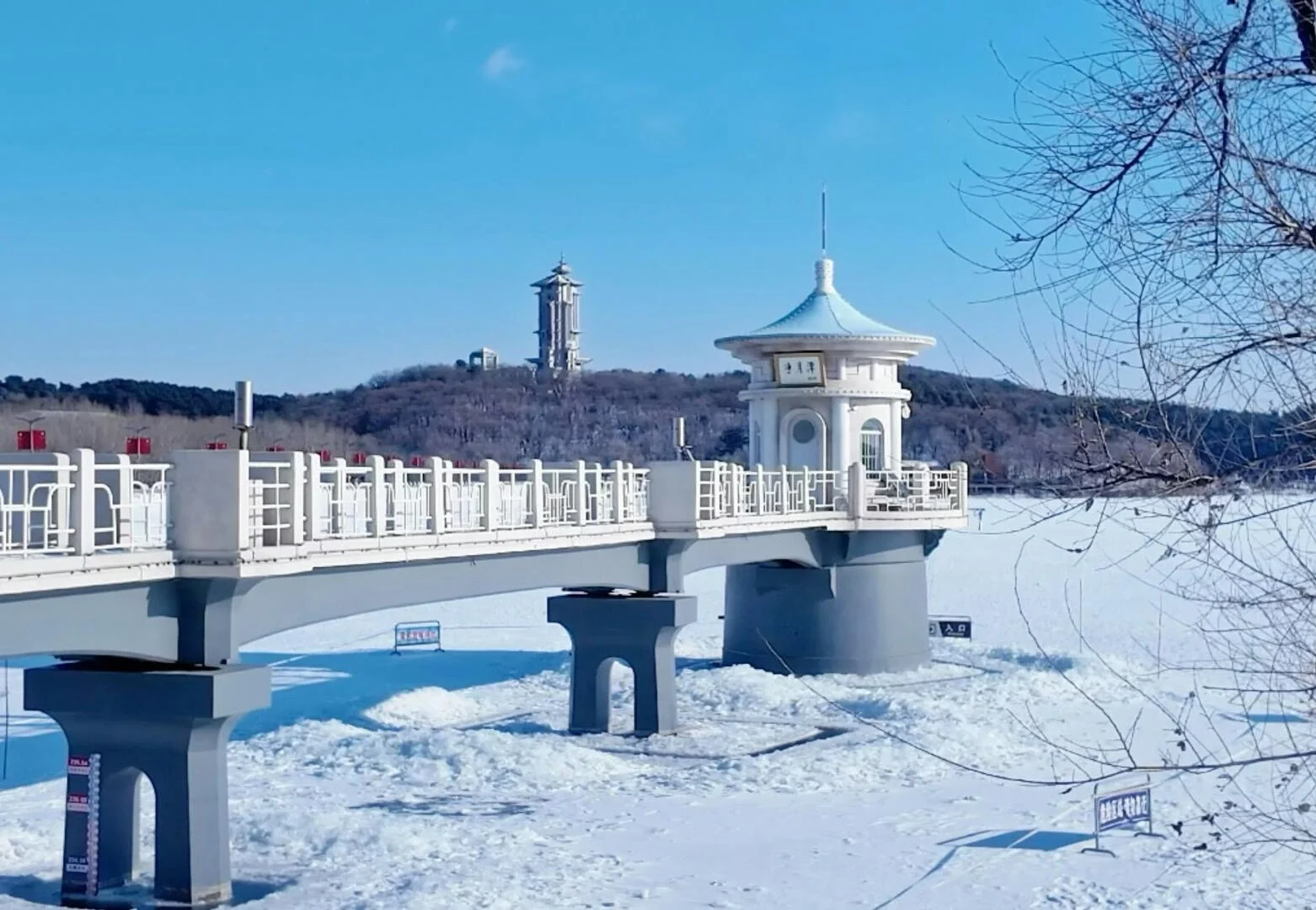Jingyuetan Winter Snow Landscape Changchun Frozen lake and pavilion with snowy surroundings showcase peaceful northern winter scenery