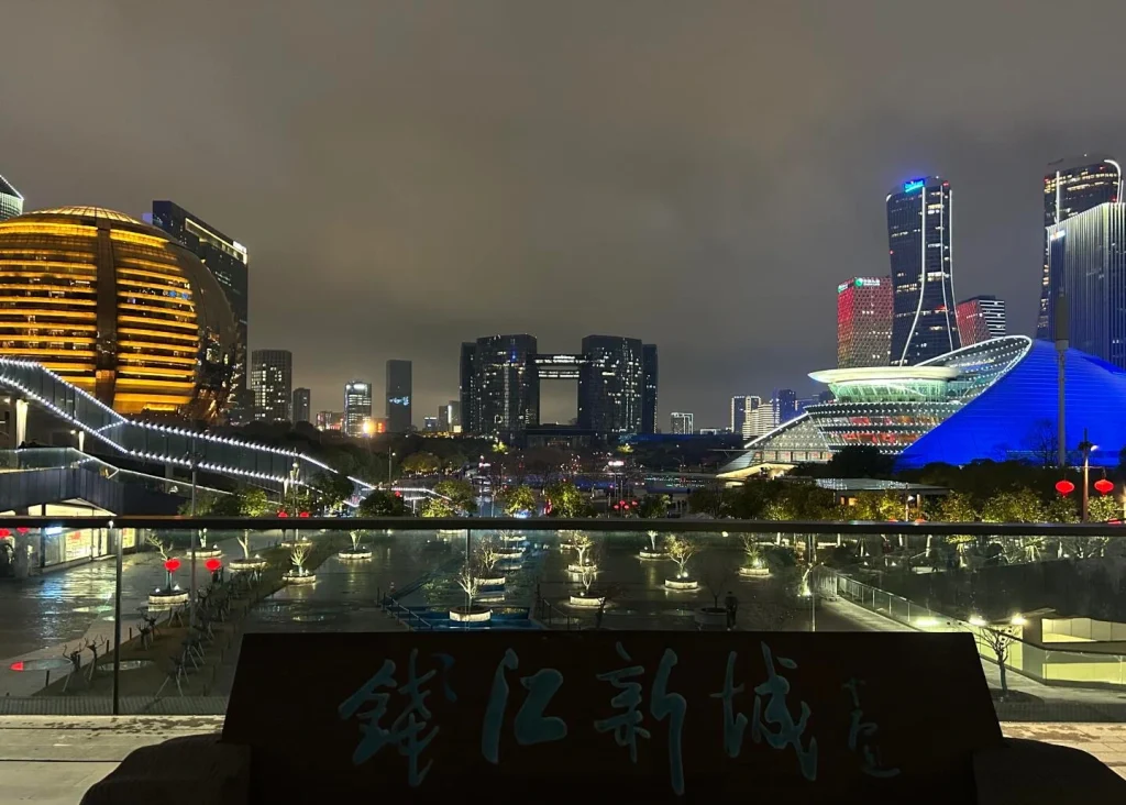 Qianjiang New City Skyline Night Futuristic architecture illuminated buildings and modern financial district along Qiantang River